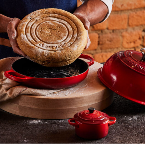 https://www.kitchenkapers.com/cdn/shop/products/le-creuset-bread-oven-cerise-bread-bottom_600x600.png?v=1675188122