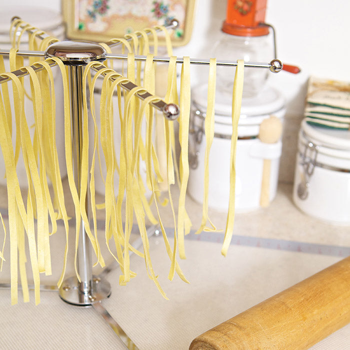 No pasta drying rack, no problem. Wrap clothes hangers in plastic