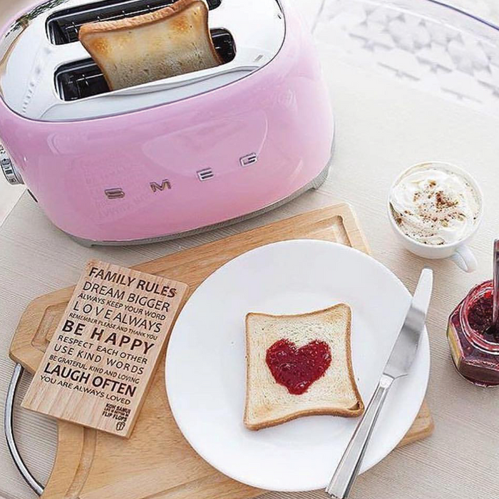 https://www.kitchenkapers.com/cdn/shop/products/smeg-2-slice-toaster-pink-lifestyle-800x800_700x700.png?v=1672072984